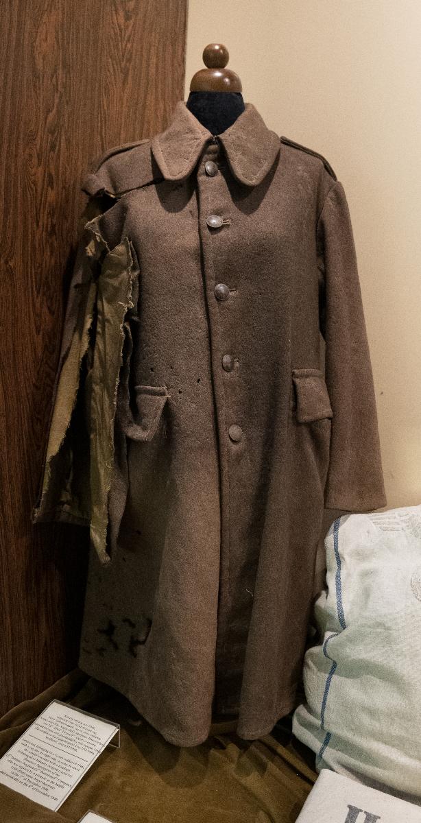 1940 Infantry Solder’s coat pierced by fragments of Italian grenades.